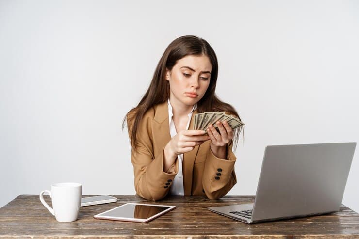 Woman is Counting Money in Office