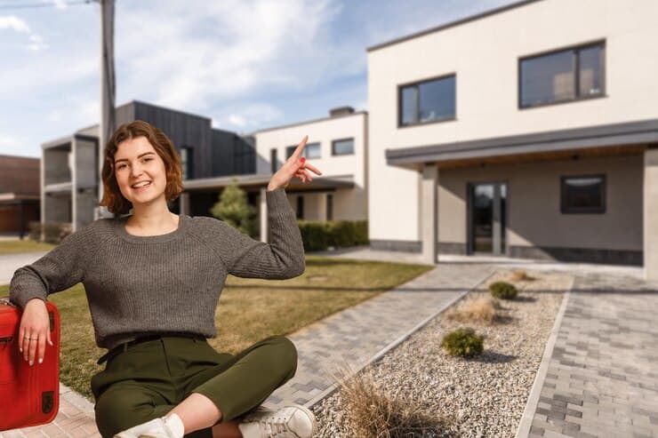 Happy House Owner on the House Background