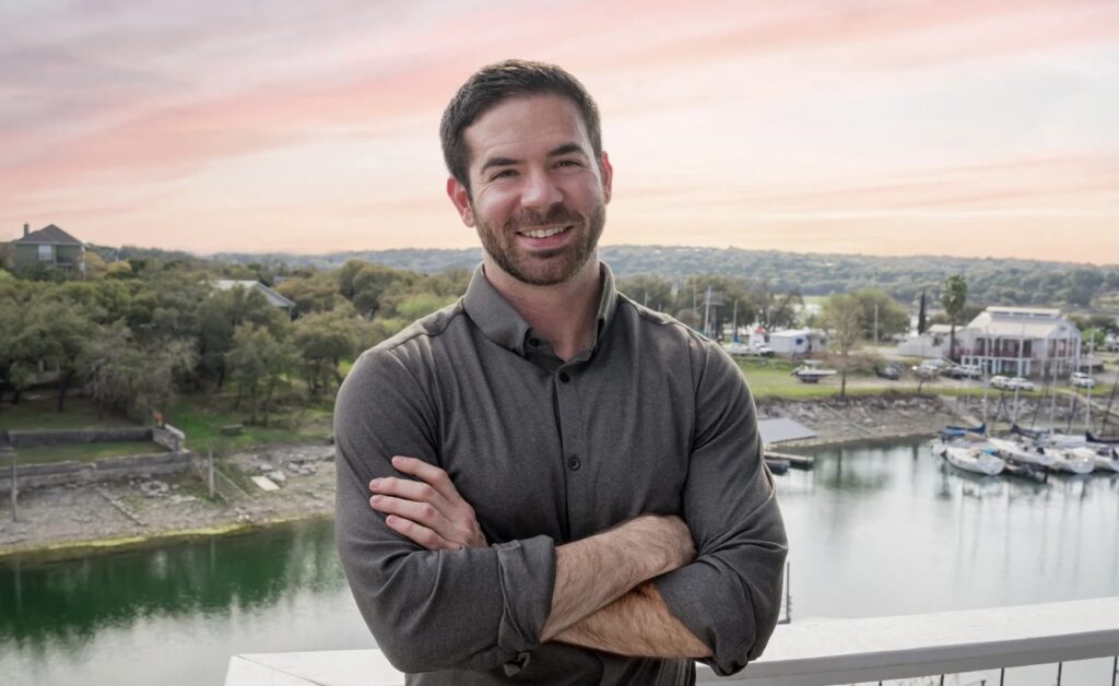 Ryan Daniel Moran with a river in the background