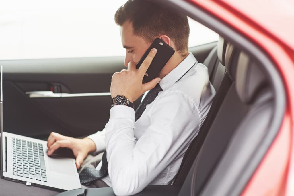 man talking on the phone in the car